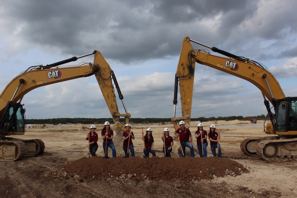 Dripping Springs ISD officials pose with shovels to commemorate the groundbreaking of High School No. 2. (Sienna Wight/Community Impact)