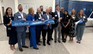 Houston Methodist employees gather to cut the ribbon at the new comprehensive care center in Cinco Ranch. (Bradley Dountz/Community Impact)