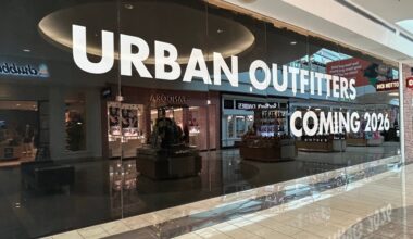 Exterior of a storefront in a mall featuring Urban Outfitters Coming 2026 temporary signage in the windows.