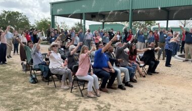Attendees tossed Honestly Texas Rice, a locally grown rice brand grown on conserved lands within the Katy Prairie Preserve, during the April 10 event. (Bradley Dountz/Community Impact)