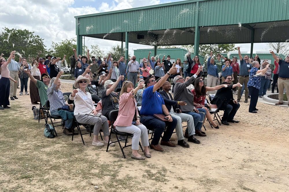 Attendees tossed Honestly Texas Rice, a locally grown rice brand grown on conserved lands within the Katy Prairie Preserve, during the April 10 event. (Bradley Dountz/Community Impact)