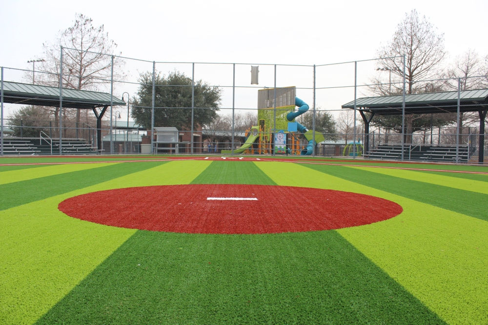 Baseball field featuring duo-toned green ground covering.