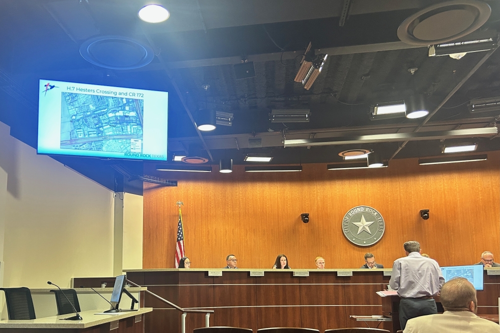 Public Works Director Michael Thane presents information about the supplemental project contract to improve water pressure near CR 172 and Hester's Crossing. (Brooke Sjoberg/Community Impact)