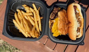 Hot dog, burger and fries in a box
