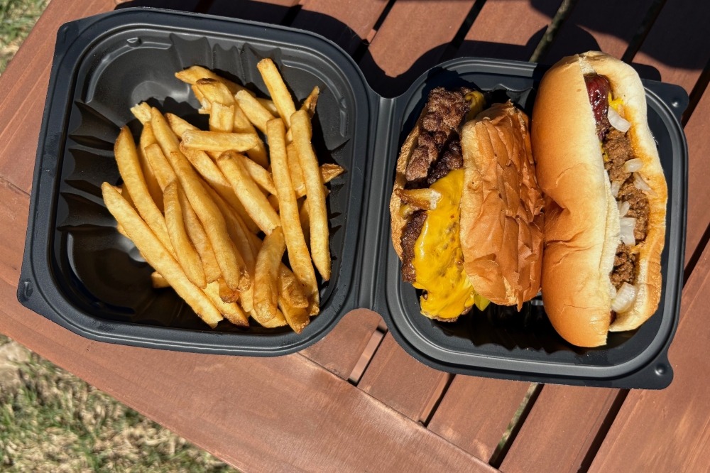Hot dog, burger and fries in a box
