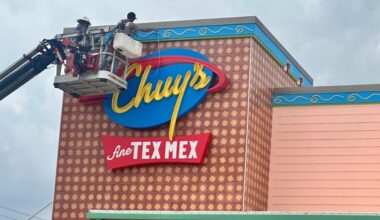 Workers install signage at Bastrop’s first Chuy’s ahead of the restaurant’s planned May 18 opening at Sendero.