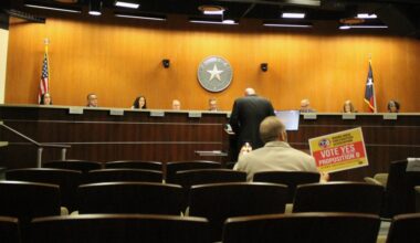 Billy Colburn, former president of RRPFA, delivers comments regarding the history of the Round Rock Fire Department at an April 9 council meeting, with Bill Clifton, secretary of the firefighters association, in the audience. (Brooke Sjoberg/Community Impact)