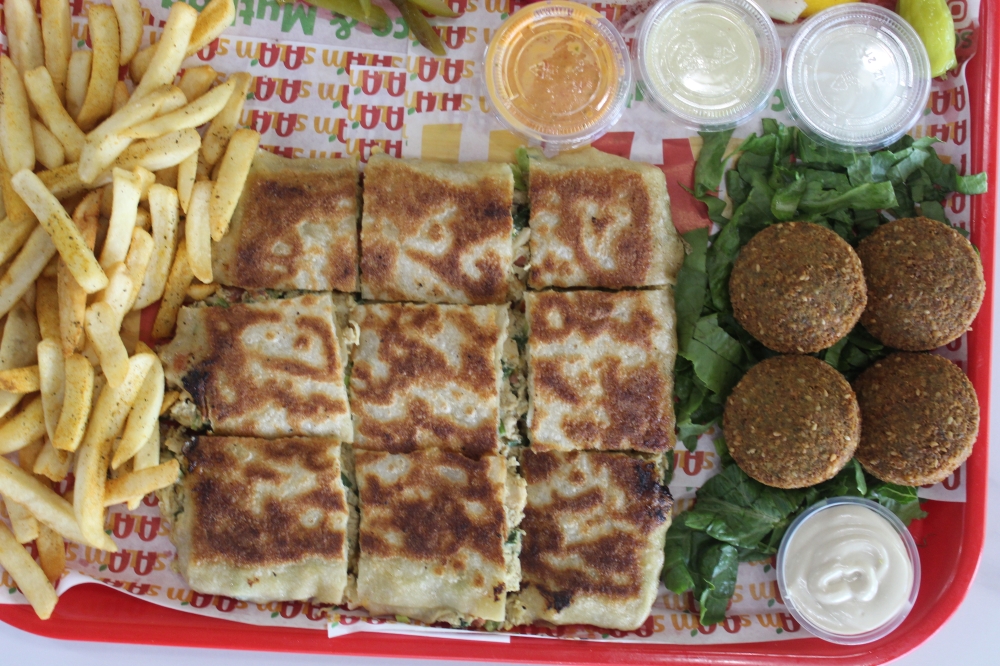 Salam Juice & Mutbaq serves hand-folded mutabbaq, a crispy stuffed flatbread that can be sweet or savory. (Isabella Zeff/Community Impact)