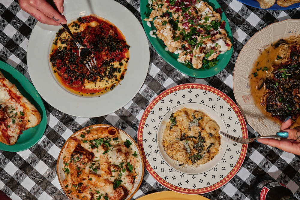A table with plates of pasta