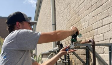 Ott Plumbing Service Manager David Fetters works on the exterior plumbing of a home in New Braunfels. (Courtesy Ott Plumbing)