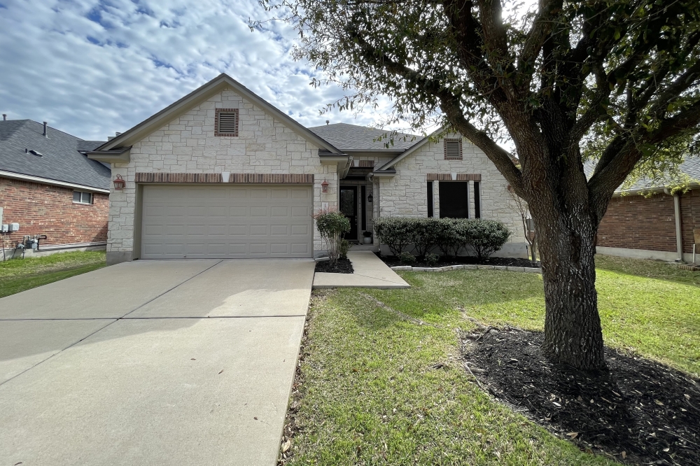 The front of a house and a yard