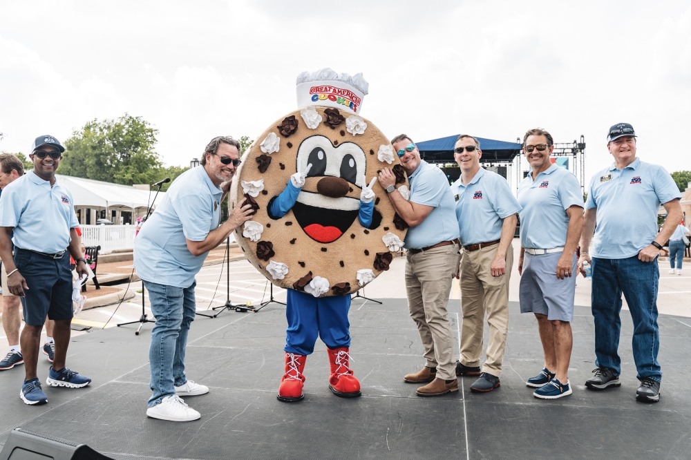 city staff with a person in a cookie costume