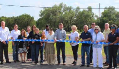 City of Round Rock and Williamson County officials held a ribbon-cutting to celebrate the completion of a project to widen Sam Bass Road on April 24. (Courtesy Williamson County)