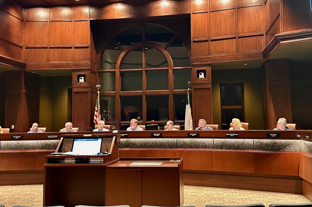 Colleyville City Council sits on the dais.