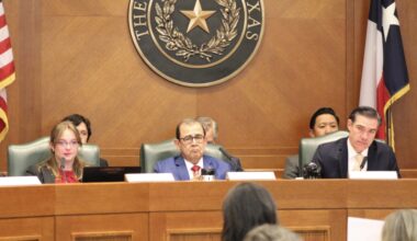 From left, committee clerk Haylee Plumley, Sen. Pete Flores, R-Pleasanton, and Rep. Morgan Meyer, R-University Park, hold back tears while listening to testimony from CiCi Steward, whose daughter, Cile, remains unaccounted for after the July 4 flood at Camp Mystic. (Hannah Norton/Community Impact)