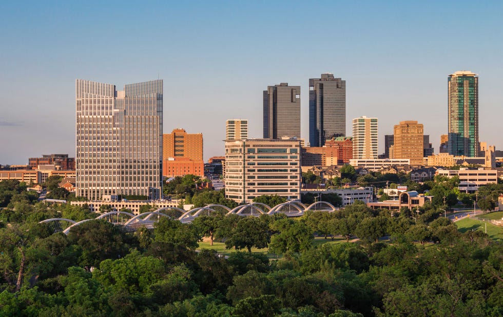 City skyline featuring modern buildings and greenery. City skyline featuring modern buildings and greenery.