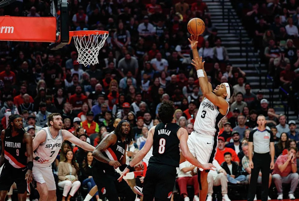 San Antonio Spurs forward <a class="link " href="https://sports.yahoo.com/nba/players/6217/" data-i13n="sec:content-canvas;subsec:anchor_text;elm:context_link" data-ylk="slk:Keldon Johnson;sec:content-canvas;subsec:anchor_text;elm:context_link;itc:0" data-yga="{"yLinkElement":"context_link","yModuleName":"content-canvas","yLinkText":"Keldon Johnson","ySubModuleName":"anchor_text","yHasCommerce":false}">Keldon Johnson</a> (3) goes up for a shot during the second quarter of Game 4 of a first-round NBA playoff series against the Portland Trail Blazers at Moda Center on Sunday, April 26, 2026. (Sam Owens/San Antonio Express-News)