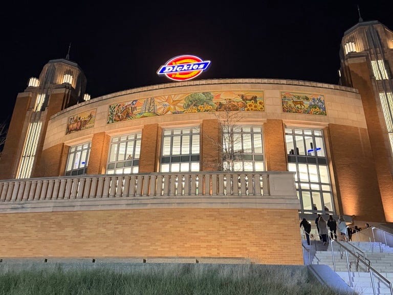 Exterior view of a building with a prominent sign. Exterior view of a building with a prominent sign.