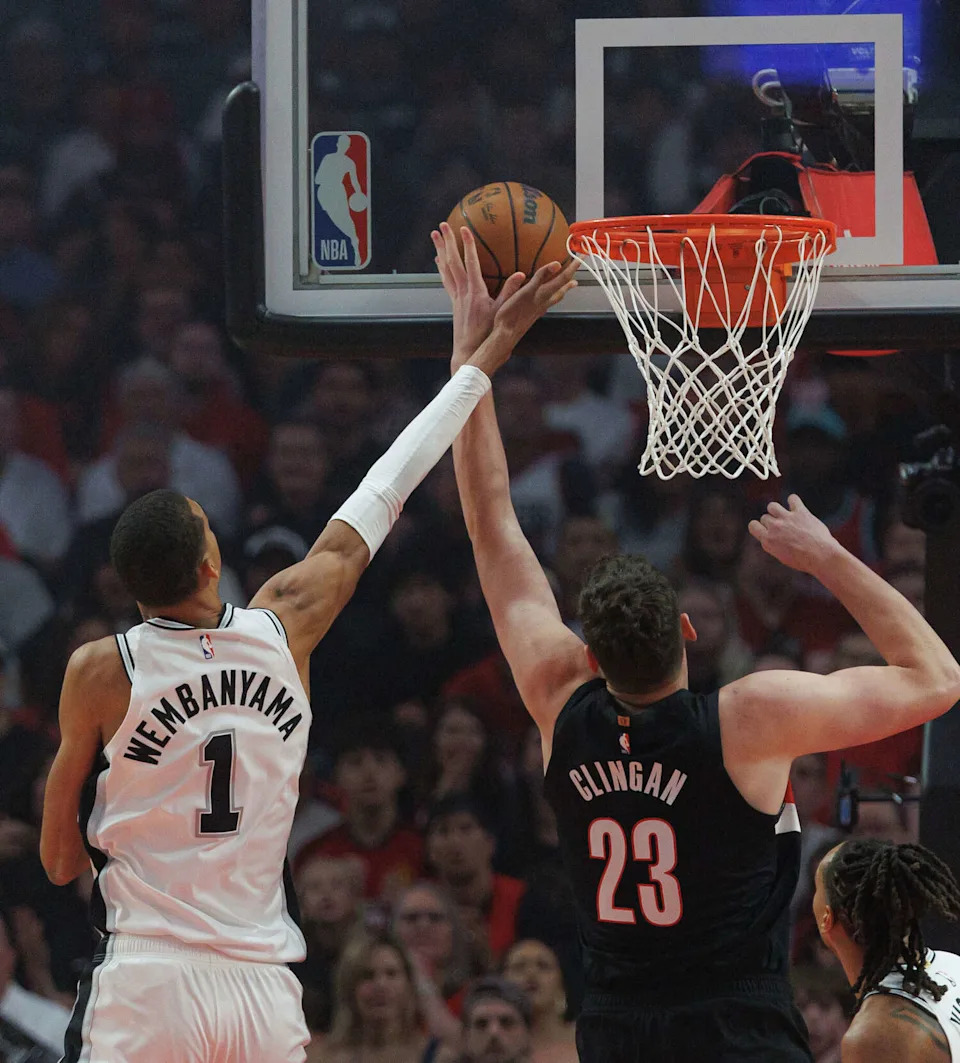 San Antonio Spurs forward Victor Wembanyama (1) blocks a shot by Portland Trail Blazers center Donovan Clingan (23) at the basket during the first quarter of Game 4 of a first-round NBA playoff series at Moda Center on Sunday, April 26, 2026. (Sam Owens/San Antonio Express-News)