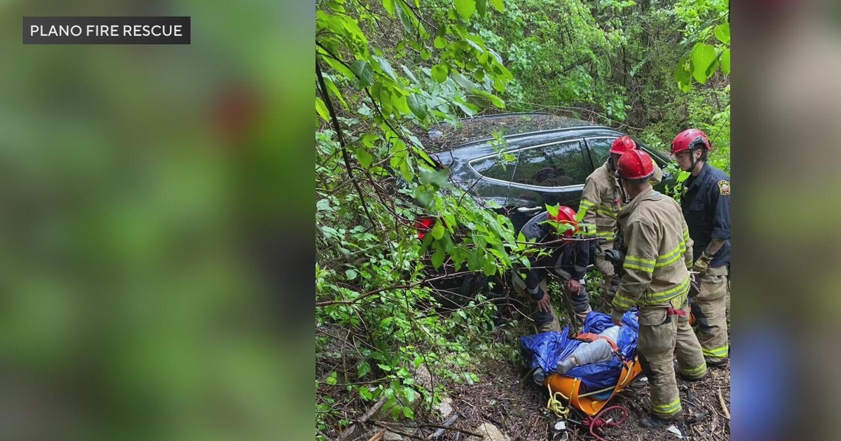 Driver rescued after car plunges 30 feet into Plano creek during morning rain