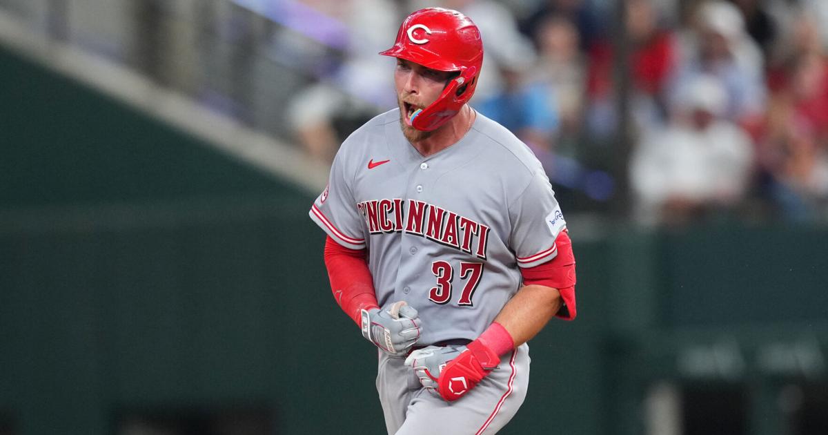 Reds beat Rangers 5-3 in their 1st road game with 3 homers, the last in the 9th |