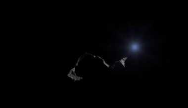 An extreme close-up of a damaged, twisted piece of metal from the Camp Mystic flood site, lit by a harsh, direct flash against a pitch-black background, conveying the stark, gritty aftermath of the tragedy.