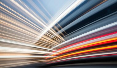 An abstract, colorful image with sweeping, blurred lines representing the motion of a vehicle, conveying the speed and energy of the automotive industry.