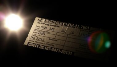 An extreme close-up of a generic shipping label or customs form, dramatically lit by a harsh flash against a dark background, conceptually representing the investigation into illegal exports.