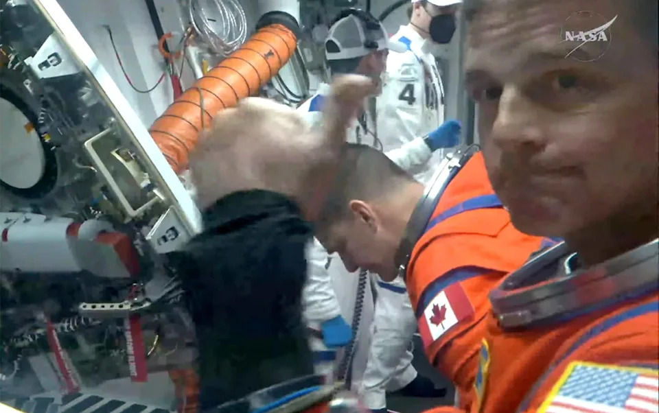 Crew members poised for the launch of Artemis II