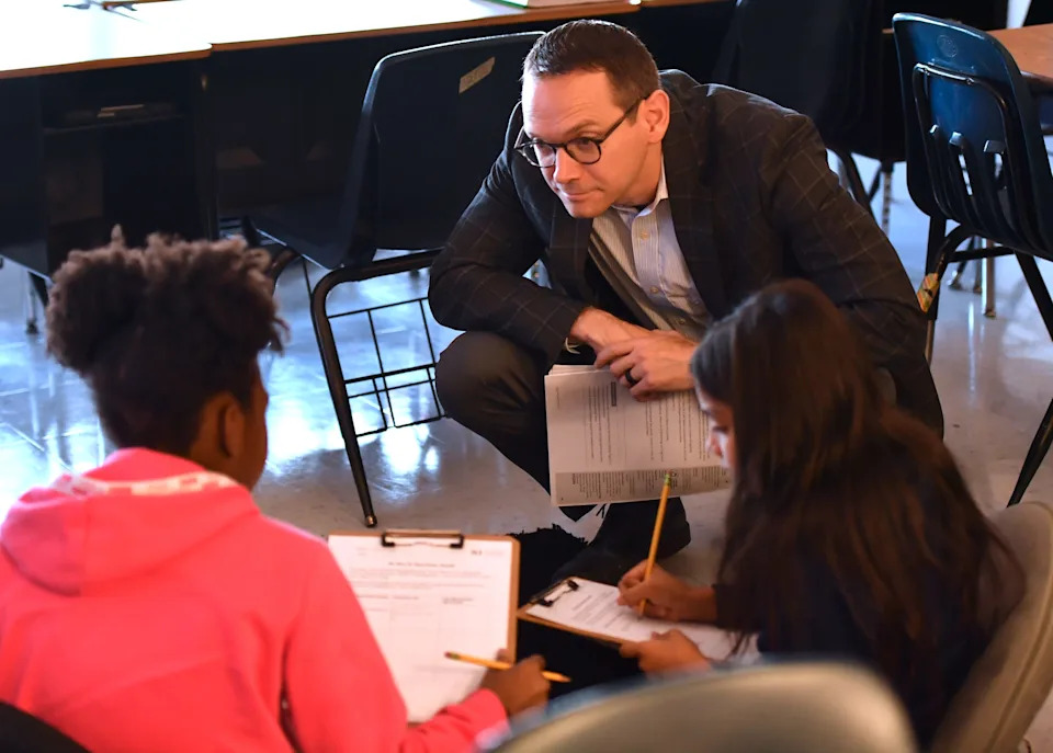 Mike Morath, the Texas Education Agency commissioner, observes and interacts with fifth grade students during a visit to Booker T. Washington Elementary School on Wednesday, Sep. 3, 2025, in Wichita Falls.