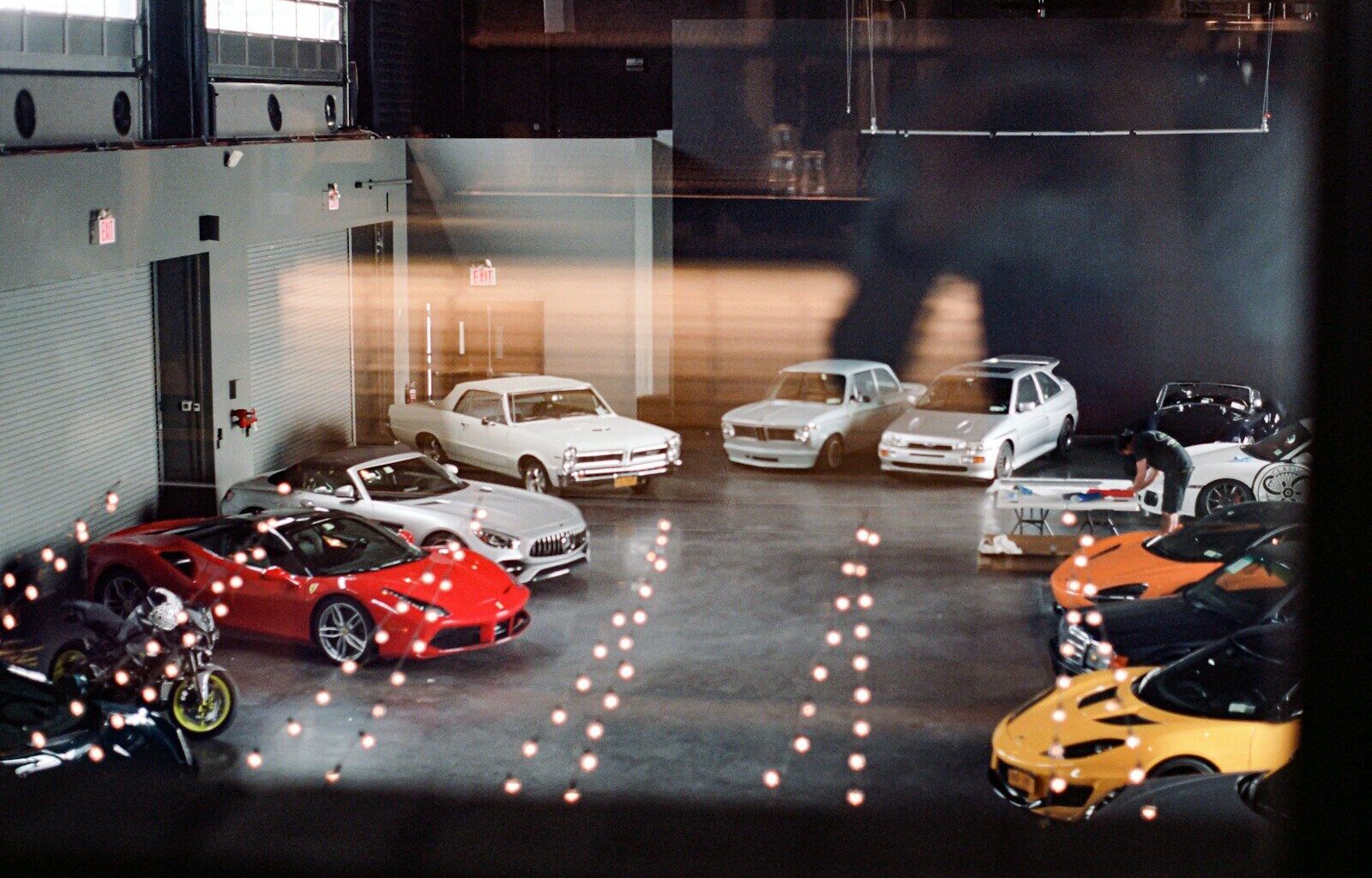a group of cars parked in a garage