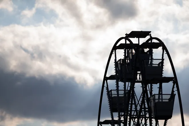 People ride the Ferris wheel at the annual Buc Days Carnival in downtown Corpus Christi on May 9, 2025.