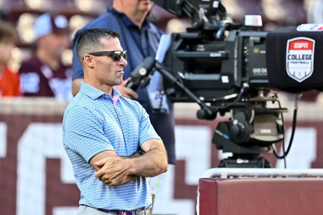 Oct 11, 2025; College Station, Texas, USA; Houston Texans executive vice president and general manager Nick Caserio watches warm up prior to the game between the Texas A&M Aggies and the Florida Gators at Kyle Field. Mandatory Credit: Maria Lysaker-Imagn Images