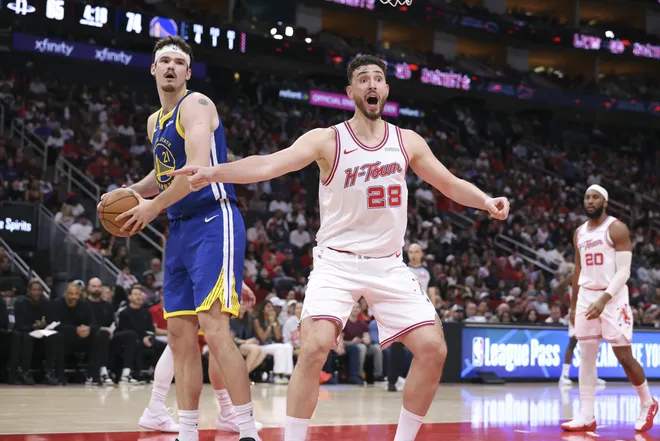 Mar 5, 2026; Houston, Texas, USA; Houston Rockets center Alperen Sengun (28) and Golden State Warriors center Quinten Post (21) react after a play during the third quarter at Toyota Center. Mandatory Credit: Troy Taormina-Imagn Images