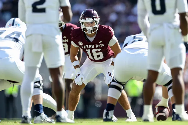 COLLEGE STATION, TEXAS - NOVEMBER 22: Noah Mikhail #16 of the Texas A&M Aggies at the line of scrimmage in the second half against the Samford Bulldogs at Kyle Field on November 22, 2025 in College Station, Texas. (Photo by Tim Warner/Getty Images)