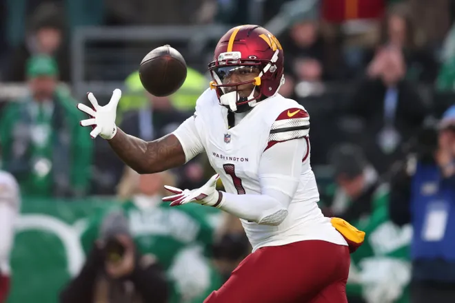 Jan 4, 2026; Philadelphia, Pennsylvania, USA; Washington Commanders wide receiver Deebo Samuel (1) makes a catch during the second quarter against the Philadelphia Eagles at Lincoln Financial Field. Mandatory Credit: Bill Streicher-Imagn Images