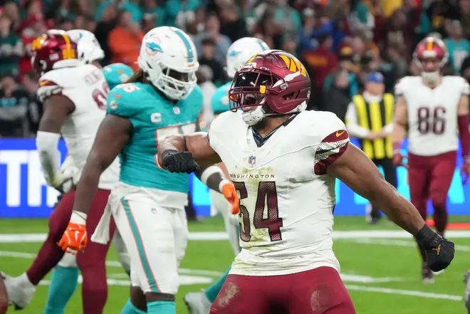 Nov 16, 2025; Madrid, Spain; Washington Commanders linebacker Bobby Wagner (54) reacts after a play against the Miami Dolphins in the fourth quarter during the 2025 NFL Madrid Game at Santiago Bernabeu Stadium. Mandatory Credit: Kirby Lee-Imagn Images