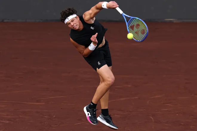 HOUSTON, TEXAS - APRIL 01: Ben Shelton of the United States serves against Zhizhen Zhang of China during the Singles match on Day 3 of the Fayez Sarofim & Co. U.S. Men's Clay Court Championship at River Oaks Country Club on April 01, 2026 in Houston, Texas. (Photo by Kenneth Richmond/Getty Images)