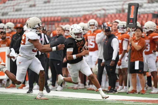 AUSTIN, TEXAS - APRIL 18: KJ Lacey Jr. #9 of the Texas Longhorns runs for yardage past Richard Wesley #99 during the Texas Spring Football Game at Darrell K Royal-Texas Memorial Stadium on April 18, 2026 in Austin, Texas. (Photo by Scott Wachter/Getty Images for ONIT)