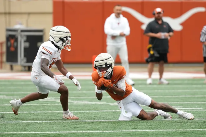 AUSTIN, TEXAS - APRIL 18: Jermaine Bishop Jr. #4 of the Texas Longhorns makes a catch ahead of Bo Mascoe #5 during the Texas Spring Football Game at Darrell K Royal-Texas Memorial Stadium on April 18, 2026 in Austin, Texas. (Photo by Scott Wachter/Getty Images for ONIT)