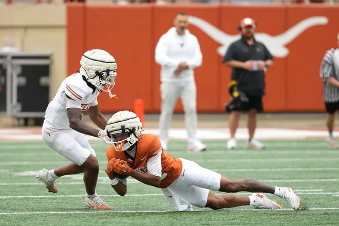 AUSTIN, TEXAS - APRIL 18: Jermaine Bishop Jr. #4 of the Texas Longhorns makes a catch ahead of Bo Mascoe #5 during the Texas Spring Football Game at Darrell K Royal-Texas Memorial Stadium on April 18, 2026 in Austin, Texas. (Photo by Scott Wachter/Getty Images for ONIT)
