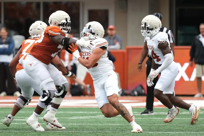 AUSTIN, TEXAS - APRIL 18: Lance Jackson #40 of the Texas Longhorns rushes the quarterback while blocked by Jonte Newman #79 during the Texas Spring Football Game at Darrell K Royal-Texas Memorial Stadium on April 18, 2026 in Austin, Texas. (Photo by Scott Wachter/Getty Images for ONIT)