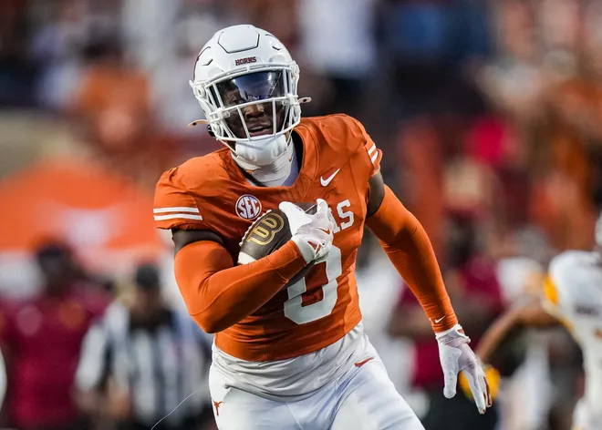 Texas Longhorns linebacker Anthony Hill runs the ball for a touchdown off an interception, which was disallowed due to an illegal block during the Longhorns' game against the ULM Warhawks at Darrell K Royal Texas Memorial Stadium. (Sara Diggins-Imagn Images)