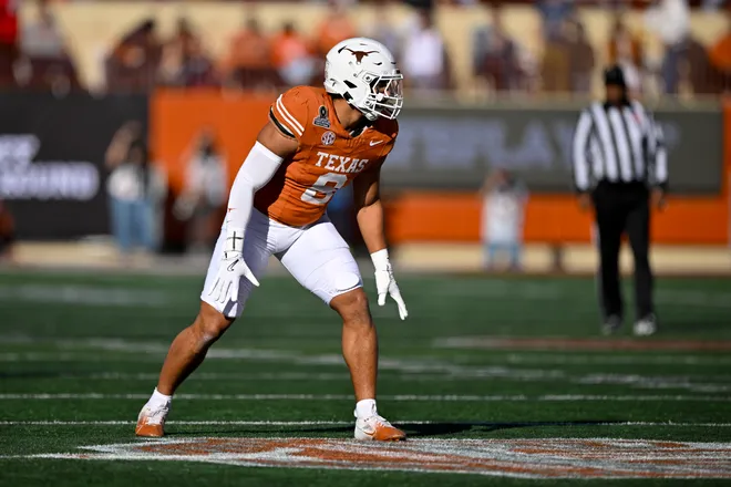 Dec 21, 2024; Austin, Texas, USA; Texas Longhorns linebacker Trey Moore (8) in action during the game between the Texas Longhorns and the Clemson Tigers in the CFP National Playoff First Round at Darrell K Royal-Texas Memorial Stadium. Mandatory Credit: Jerome Miron-Imagn Images