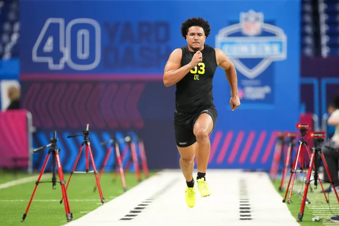 Feb 26, 2026; Indianapolis, IN, USA; Texas defensive lineman Trey Moore (DL53) runs the 40-yard dash during the NFL Scouting Combine at Lucas Oil Stadium. Mandatory Credit: Kirby Lee-Imagn Images
