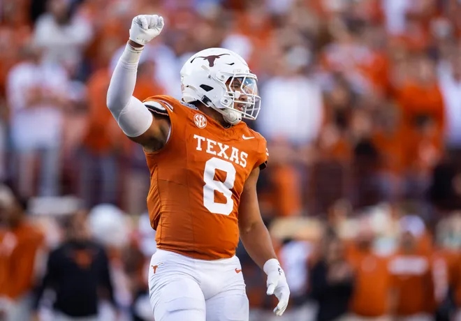 Dec 21, 2024; Austin, Texas, USA; Texas Longhorns edge Trey Moore (8) against the Clemson Tigers during the CFP National playoff first round at Darrell K Royal-Texas Memorial Stadium. Mandatory Credit: Mark J. Rebilas-Imagn Images
