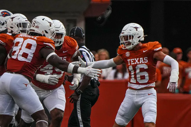 Sep 14, 2024; Austin, Texas, USA; Texas Longhorns defensive back Michael Taaffe (16) and edge Barryn Sorrell (88) celebrate a fourth down stop during the game against UTSA at Darrell K Royal–Texas Memorial Stadium. Mandatory Credit: Aaron E. Martinez/USA TODAY Network via Imagn Images