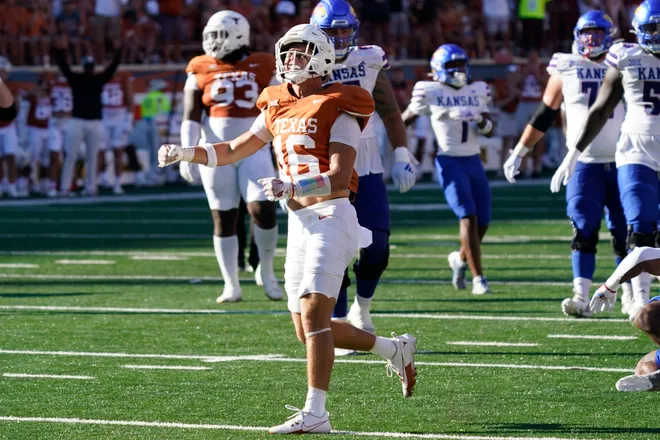 Sep 30, 2023; Austin, Texas, USA; Texas Longhorns defensive back Michael Taaffe (16) reacts after making a tackle against the Kansas Jayhawks during the second half at Darrell K Royal-Texas Memorial Stadium. Mandatory Credit: Scott Wachter-USA TODAY Sports