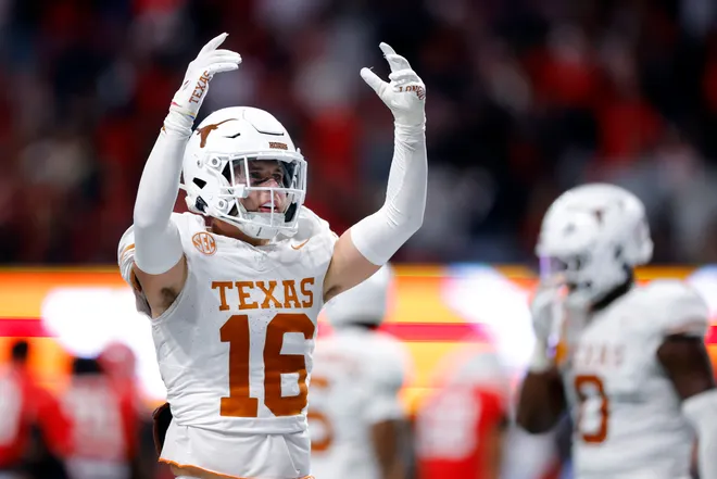 ATLANTA, GEORGIA - DECEMBER 07: Michael Taaffe #16 of the Texas Longhorns reacts to a play against the Georgia Bulldogs during the fourth quarter of the 2024 SEC Championship at Mercedes-Benz Stadium on December 07, 2024 in Atlanta, Georgia. (Photo by Todd Kirkland/Getty Images)
