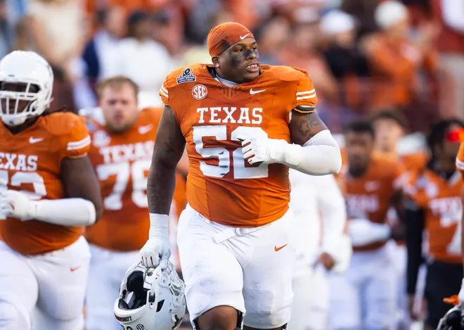 Dec 21, 2024; Austin, Texas, USA; Texas Longhorns offensive lineman DJ Campbell (52) against the Clemson Tigers during the CFP National playoff first round at Darrell K Royal-Texas Memorial Stadium. Mandatory Credit: Mark J. Rebilas-Imagn Images